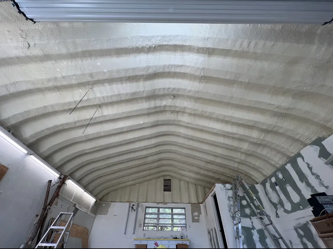 Spray polyurethane foam applied to the underside of a metal roof deck in Eustis